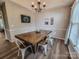 Elegant dining room with a wooden table, perfect for Gathering dinners at 6231 Kentwood Dr, Kannapolis, NC 28081
