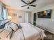 Bright main bedroom featuring a ceiling fan, television, and ensuite access at 6231 Kentwood Dr, Kannapolis, NC 28081