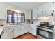 Functional kitchen with essential appliances, ample cabinet space, and natural light from the window at 6323 Wilora Lake Rd, Charlotte, NC 28212