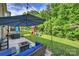 Inviting backyard with patio, play area, lush greenery, perfect for outdoor entertaining and relaxation at 6618 Vizcaya Ct, Charlotte, NC 28226