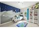 A playful bedroom features unique wall decor and a cozy area rug at 6618 Vizcaya Ct, Charlotte, NC 28226