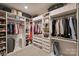 Spacious walk-in closet with custom shelving and ample storage for clothes, shoes, and accessories at 6618 Vizcaya Ct, Charlotte, NC 28226