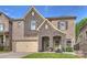 Charming two-story brick home with a stone facade, attached garage, and well-manicured lawn at 6618 Vizcaya Ct, Charlotte, NC 28226