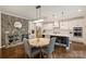 Eat-in kitchen features a round table, granite counters, stainless steel appliances, and pendant lighting at 6618 Vizcaya Ct, Charlotte, NC 28226