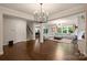 Spacious living room with hardwood floors, large sectional sofa, and lots of natural light at 6618 Vizcaya Ct, Charlotte, NC 28226