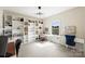 Spacious office featuring built-in bookshelves, ample natural light, and multiple workstations at 6618 Vizcaya Ct, Charlotte, NC 28226