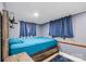 This bedroom has soft lighting and includes a dark, rustic nightstand with wooden bed frame at 715 Potneck Rd, Salisbury, NC 28147