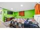 This bedroom boasts natural light, colorful walls, and sleek television above a wooden media center at 715 Potneck Rd, Salisbury, NC 28147