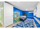This bedroom is decorated with a blue accent wall and has colorful kid friendly storage at 715 Potneck Rd, Salisbury, NC 28147