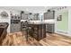 Stylish kitchen with gray cabinets, a wood island, and modern appliances, perfect for culinary enthusiasts at 715 Potneck Rd, Salisbury, NC 28147