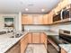 Modern kitchen features granite countertops, stainless steel appliances and ample cabinet space at 718 W Trade St # 704, Charlotte, NC 28202