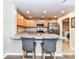 Beautiful kitchen with breakfast bar, granite countertops, stainless steel appliances and bright lighting at 718 W Trade St # 704, Charlotte, NC 28202