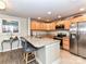 Bright kitchen features granite countertops, stainless steel appliances, and a breakfast bar with seating at 718 W Trade St # 704, Charlotte, NC 28202