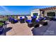 Enjoy outdoor living with comfortable seating, a fire pit, and a grill on the roof top deck at 718 W Trade St # 704, Charlotte, NC 28202
