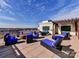 Expansive rooftop deck features lounge seating, dining area, outdoor grill and fire pit with amazing city views at 718 W Trade St # 704, Charlotte, NC 28202