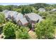 Aerial view of a beautiful brick home with a well-maintained landscape at 7525 Blackgum Falls Ct, Huntersville, NC 28078