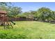 A spacious fenced backyard with a playset at 7525 Blackgum Falls Ct, Huntersville, NC 28078