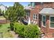 Relaxing backyard deck with outdoor furniture, grill, and green shrubbery at 7525 Blackgum Falls Ct, Huntersville, NC 28078