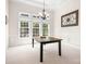 Dining room with large window and chandelier at 7525 Blackgum Falls Ct, Huntersville, NC 28078