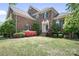 Brick home boasting an inviting entryway, neat landscaping, and classic architectural details for a timeless appeal at 7525 Blackgum Falls Ct, Huntersville, NC 28078