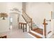 Bright foyer with hardwood floors, staircase, and elegant decor at 7525 Blackgum Falls Ct, Huntersville, NC 28078