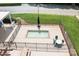 Community hot tub surrounded by a metal fence, tables, and benches at 7525 Blackgum Falls Ct, Huntersville, NC 28078