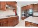 Modern kitchen featuring stainless steel appliances, custom cabinets, and a gas cooktop for culinary enthusiasts at 7525 Blackgum Falls Ct, Huntersville, NC 28078