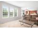 Bright living room featuring many windows, recessed lighting and a smooth transition into dining area at 7525 Blackgum Falls Ct, Huntersville, NC 28078