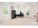 Bright office space with carpeted floors and three large windows for lots of natural light at 7525 Blackgum Falls Ct, Huntersville, NC 28078