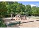Outdoor playground surrounded by mulch, and includes a bench at 7525 Blackgum Falls Ct, Huntersville, NC 28078