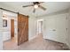 Bedroom features new flooring, closet, a sliding barn door and connects to the kitchen at 814 Marve St, Gastonia, NC 28052