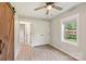 Bedroom with new flooring, two windows, a closet and a sliding barn door at 814 Marve St, Gastonia, NC 28052