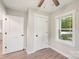 Bedroom features two white doors, a window and a ceiling fan at 814 Marve St, Gastonia, NC 28052