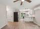 Modern kitchen with white cabinets, new appliances, and wood-look flooring at 814 Marve St, Gastonia, NC 28052