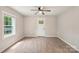 Bright room featuring new floors, a ceiling fan, and natural light from the window at 814 Marve St, Gastonia, NC 28052