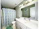 Standard bathroom with a tub and shower combo, single sink, and large mirror at 8218 Lynnewood Glen Dr, Charlotte, NC 28269