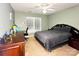 This bedroom features neutral colored walls, carpeted floor, and a large window for natural light at 8218 Lynnewood Glen Dr, Charlotte, NC 28269