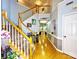 Spacious entrance foyer featuring hardwood floors, an elegant staircase, and a view into living spaces at 8218 Lynnewood Glen Dr, Charlotte, NC 28269
