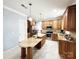 Bright and airy kitchen with an island, stainless steel appliances, and tile flooring at 8218 Lynnewood Glen Dr, Charlotte, NC 28269