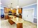 Well-equipped kitchen featuring granite countertops, a large island, and stainless steel appliances at 8218 Lynnewood Glen Dr, Charlotte, NC 28269