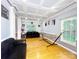 Bright living room featuring hardwood floors, a tray ceiling, and ample natural light at 8218 Lynnewood Glen Dr, Charlotte, NC 28269