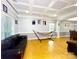 Inviting living room boasts a tray ceiling, hardwood floors, and a cozy atmosphere with a hammock at 8218 Lynnewood Glen Dr, Charlotte, NC 28269