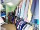 A large walk-in closet with organized shelving and hanging racks, ideal for ample storage at 8218 Lynnewood Glen Dr, Charlotte, NC 28269