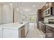 Modern kitchen featuring stainless steel appliances, quartz countertops, and a stylish island at 838 Van Every St, Charlotte, NC 28205