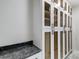 Custom cabinetry with glass doors offers ample storage space and granite countertop area at 8707 Fairview Rd, Charlotte, NC 28226