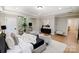 Open main bedroom with sitting area, hardwood floors, and modern decor at 8707 Fairview Rd, Charlotte, NC 28226