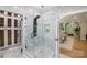 Stylish shower with a glass door and multiple shower heads at 8707 Fairview Rd, Charlotte, NC 28226