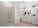 Bright bathroom features a tiled walk-in shower, soaking tub, and double vanity with rectangular mirrors at 9002 Maple Hill Ct, Huntersville, NC 28078