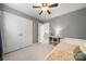 Well-lit bedroom offers generous closet space, a ceiling fan, and neutral paint for a calm space at 9002 Maple Hill Ct, Huntersville, NC 28078