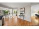 Open-concept living room featuring hardwood floors and abundant natural light at 9002 Maple Hill Ct, Huntersville, NC 28078
